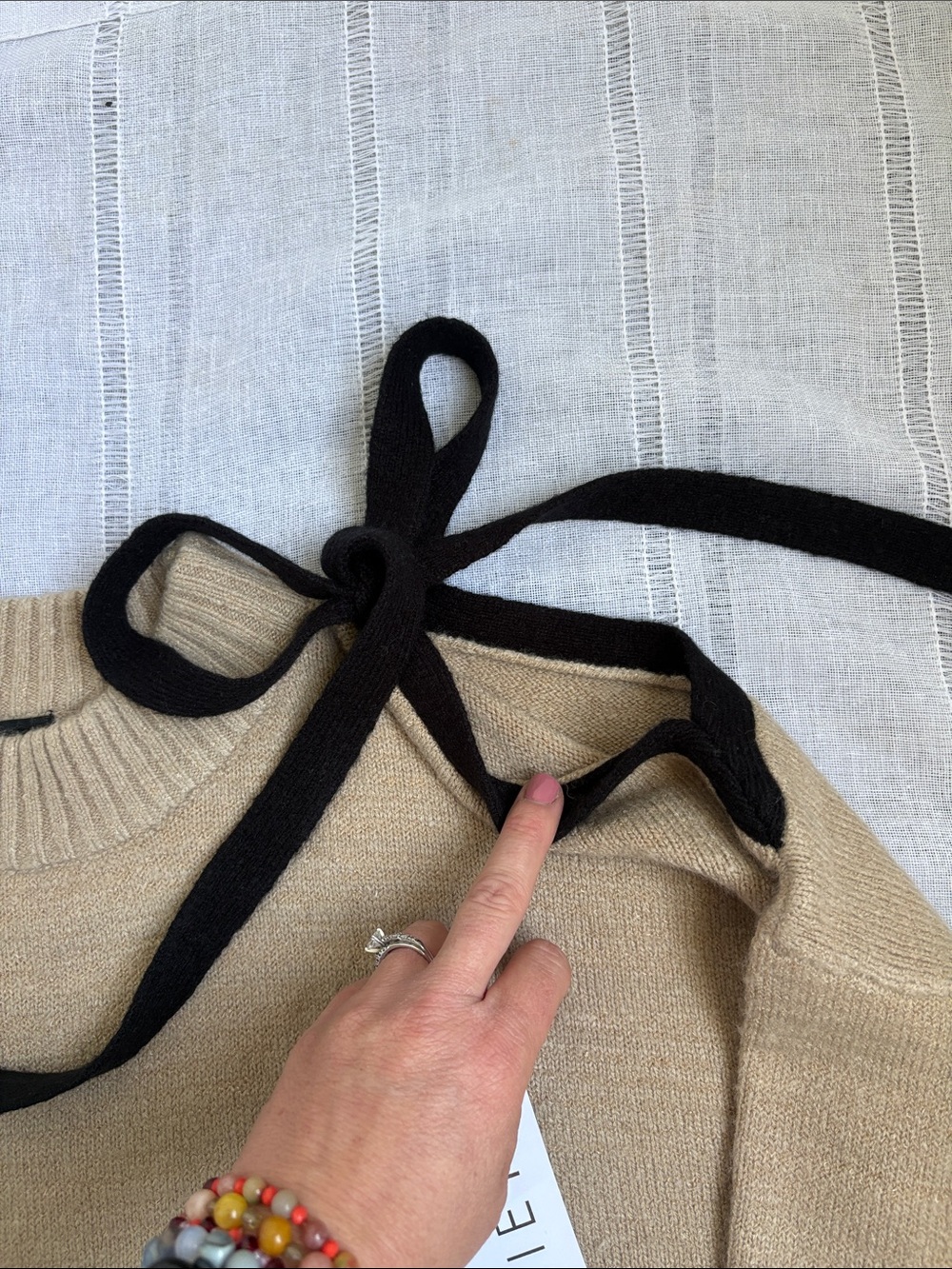 Lumiere’s Beige Cold-Shoulder Knit Sweater with Black Tie Details - Picture 8 of 13
